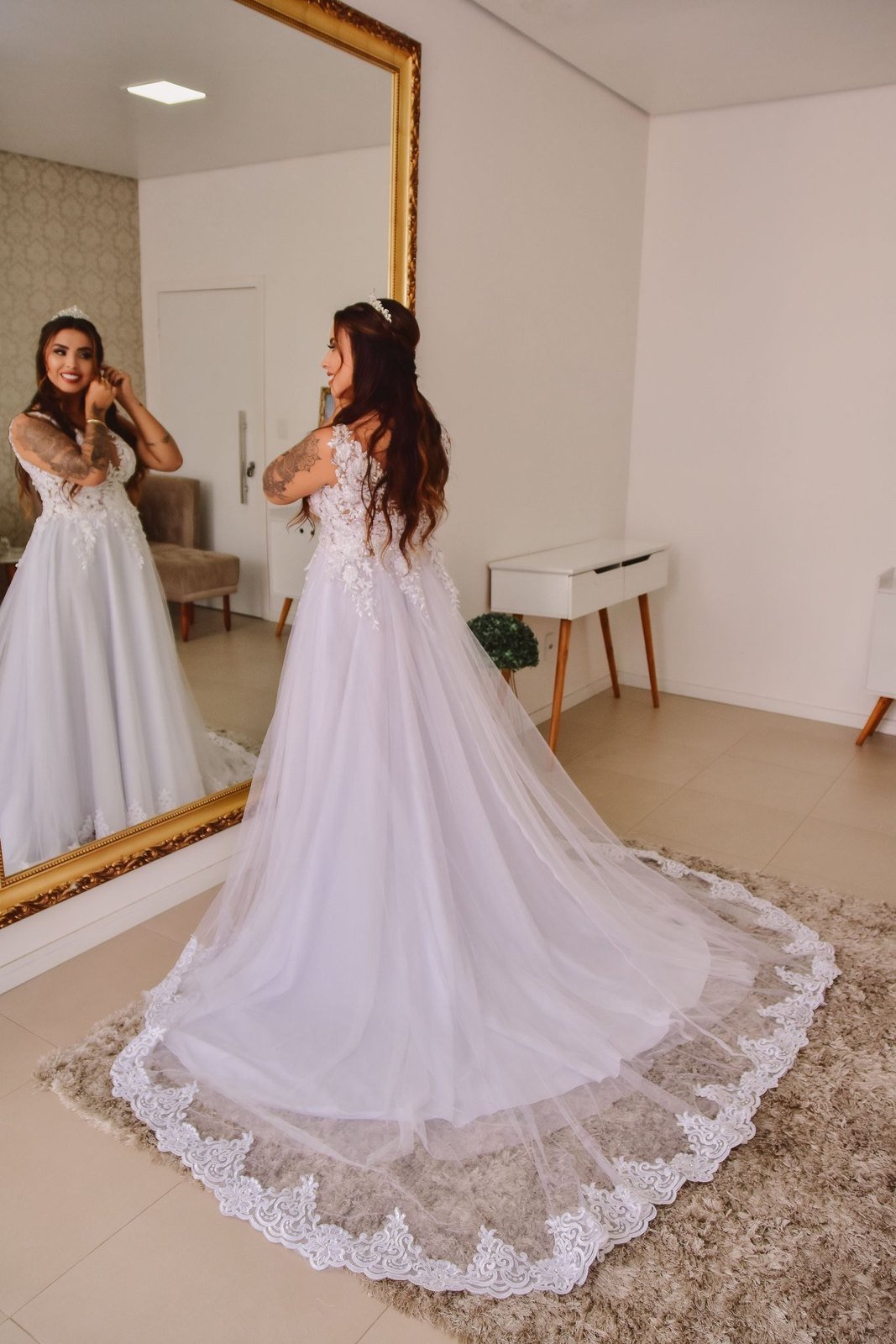 Bride looking at mirror after hairstyling